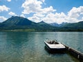 St. Wolfgang/Austria - june 2 2019: a motor boat docked on st Wolfgang lake with the alps on the background