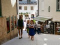 St Wolfgang/Austria - June 2 2019: People walking on a Street of the old town of St. Wolfgang wearing typical austrian dresses