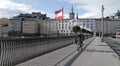 StaatsbrÃÂ¼cke bridge in Salzburg with Austrian flag.