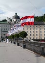 StaatsbrÃÂ¼cke bridge in Salzburg with Austrian flag.