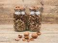 Stab and shelled walnuts on a wooden background. Royalty Free Stock Photo