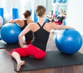 Stability ball in women Pilates class rear view Royalty Free Stock Photo