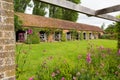 Stable block Barrington Court near Ilminster Somerset England uk with gardens in summer sunshine