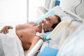 Middle aged man sleeping in hospital room after surgery Royalty Free Stock Photo