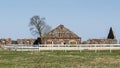 Stabling. Stone masonry with red-brick plastered decoration