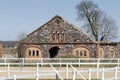 Stabling. Stone masonry with red-brick plastered decoration