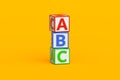 Stack of ABC cubes on orange background. Letter blocks for preschool education. Learning alphabet. Royalty Free Stock Photo