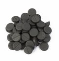 Stack of activated carbon on white background