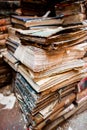 Stack of Aged Books With Worn Covers and Weathered Pages in Atmospheric Setting Royalty Free Stock Photo