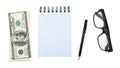 Stack American money hundred dollar bill, notebook or notepad, pen, glasses, isolated on white background clipping path. Royalty Free Stock Photo