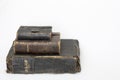 Stack of Antique Bibles on White Background