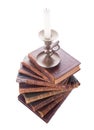 Stack antique books and candlestick Royalty Free Stock Photo