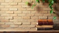 A stack of antique leather-bound books rests on a rustic wooden surface against a backdrop of a textured brick wall, adorned with Royalty Free Stock Photo