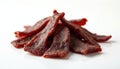 Stack of appetizing biltong, a South African dried meat snack. Thick strips of cured beef feature marinated spices like coriander Royalty Free Stock Photo