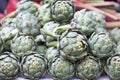 Stack of artichokes on a market stall Royalty Free Stock Photo