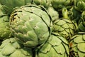 Stack of artichokes on a market stall Royalty Free Stock Photo