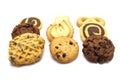 Stack of assorted cookies. Chocolate chip, oatmeal, raisin, Danish cookies and biscuits in the shape of a spiral pattern isolated