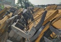 Stack of assorted metal and wooden chairs in random disarray, full frame furniture background image