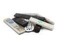 Stack of audio video remote control device in white background