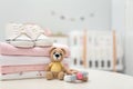 Stack of baby clothes, shoes and accessories on white table indoors, closeup Royalty Free Stock Photo