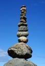 Stack of balanced pebbles, stones against blue sky Royalty Free Stock Photo