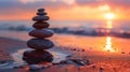 A stack of balanced stones on the ocean beach at sunset. Meditation and spa concept. Royalty Free Stock Photo