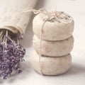 Stack of bars natural lavender soap. Bouquet of lavender in old newspaper. Scin care. Spa, relax, wellness time. Gift wrapping.