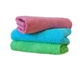 Stack of bath towels on light wooden background closeup.Pile of rainbow colored towels.Top view. Royalty Free Stock Photo