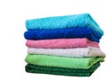 Stack of bath towels on light wooden background closeup.Pile of rainbow colored towels.Top view. Royalty Free Stock Photo