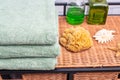 stack of bath towels on a wicker nightstand. Rattan furniture and towels in the bathroom