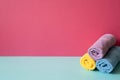 Stack of bathroom shower towels on skyblue shelf. pink wall background Royalty Free Stock Photo