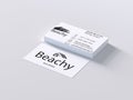 Stack of beachy branded business cards with one card placed in front isolated on white background Royalty Free Stock Photo