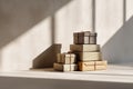 Stack of beautifully wrapped gift boxes with natural light and shadows creating a serene atmosphere Royalty Free Stock Photo