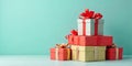 Stack of beautifully wrapped gifts against a teal background Royalty Free Stock Photo