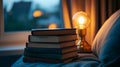 Stack of bedtime storybooks next to nightlight. Royalty Free Stock Photo