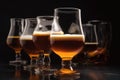 stack of beer glasses with foamy head and rich amber liquid