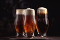 stack of beer glasses with foamy head and rich amber liquid