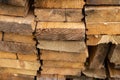 Stack beige boards construction of natural material close-up end  bar Royalty Free Stock Photo