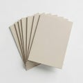 Stack of beige cardboard sheets with corrugated texture on a white background Royalty Free Stock Photo