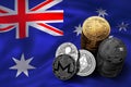 Stack of Bitcoin coins on Australian flag. Situation of Bitcoin and other cryptocurrencies in Australia