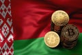 Stack of Bitcoin coins on Belarusian flag. Situation of Bitcoin and other cryptocurrencies in Belarus Royalty Free Stock Photo