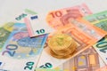 A Stack of Bitcoin Coins on the Euro Banknotes Royalty Free Stock Photo