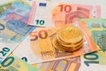 A Stack of Bitcoin Coins on the Euro Banknotes Royalty Free Stock Photo