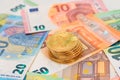 A Stack of Bitcoin Coins on the Euro Banknotes Royalty Free Stock Photo