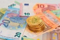 A Stack of Bitcoin Coins on the Euro Banknotes Royalty Free Stock Photo