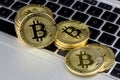 Stack of Bitcoin coins on laptop keyboard. Cryptocurrency. Selective focus Royalty Free Stock Photo