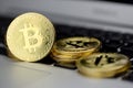 Stack of Bitcoin coins on laptop keyboard. Cryptocurrency. Selective focus Royalty Free Stock Photo