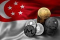 Stack of Bitcoin coins on Singaporean flag. Situation of Bitcoin and other cryptocurrencies