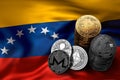 Stack of Bitcoin and other crypto coins on Venezuelian flag.