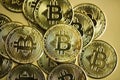 Stack of bitcoins against golden background. Cryptocurrency concept Royalty Free Stock Photo